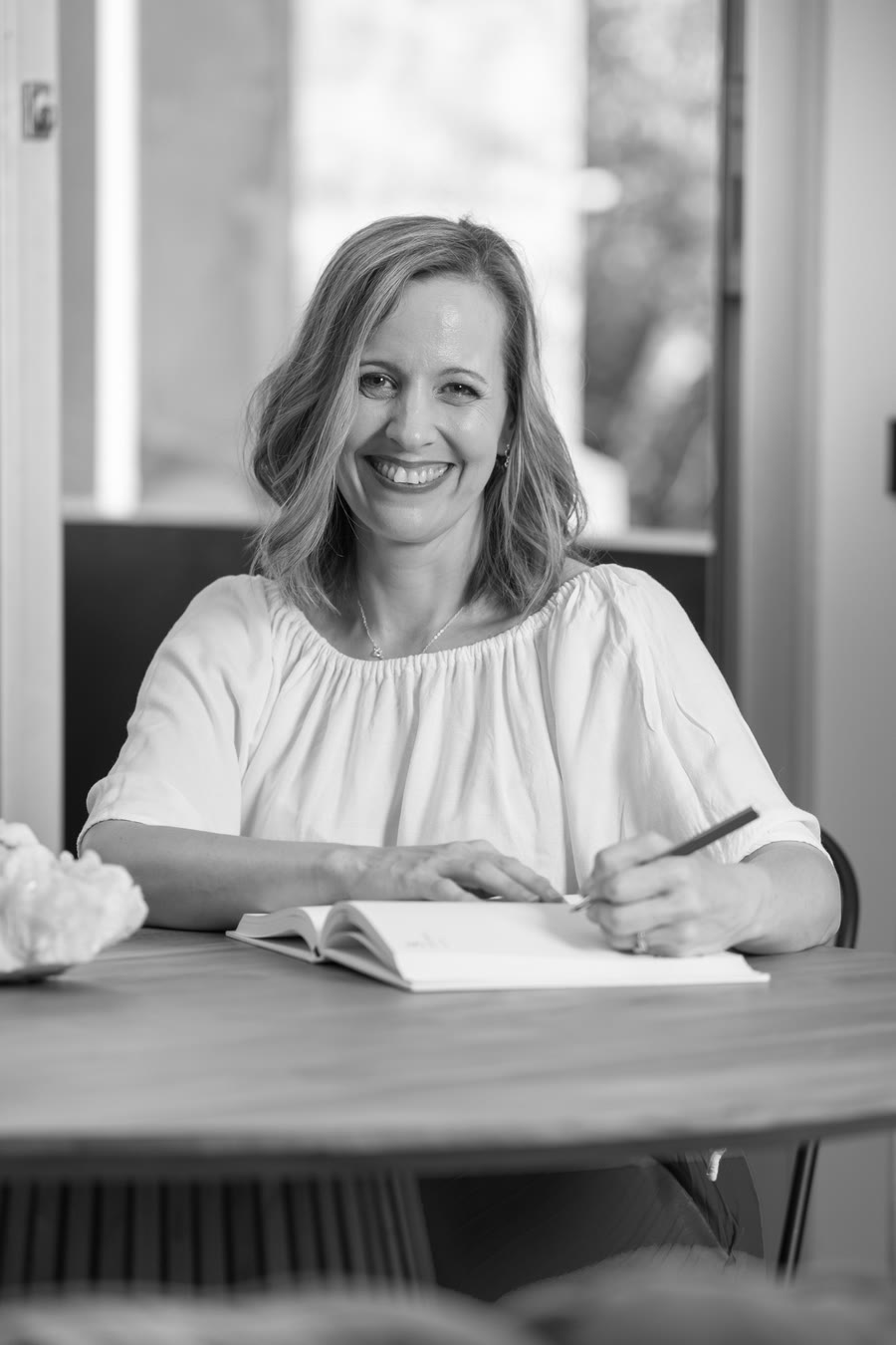 Sharon Crombie working at a table